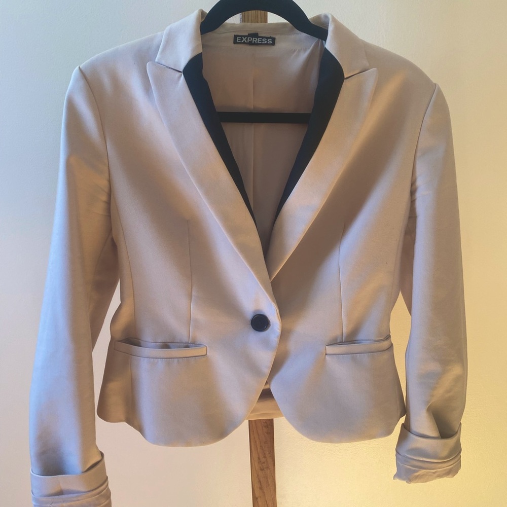 Light pink, (almost tan) Express blazer with black trim.